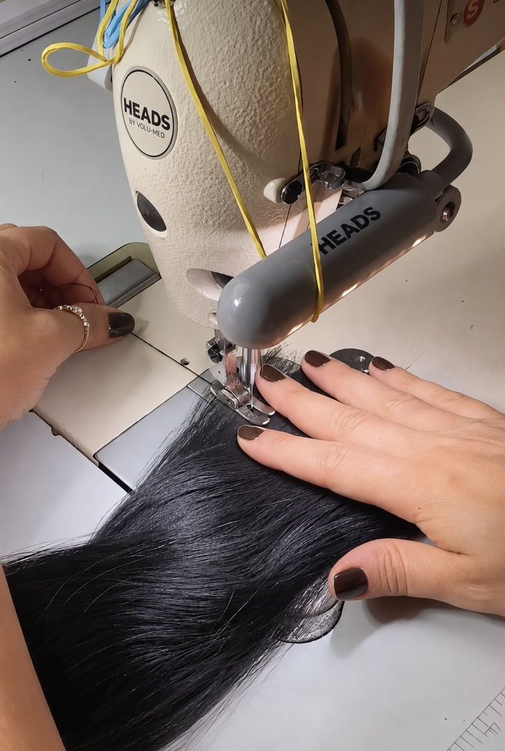 HEADS sewing station joining wefts of real hair