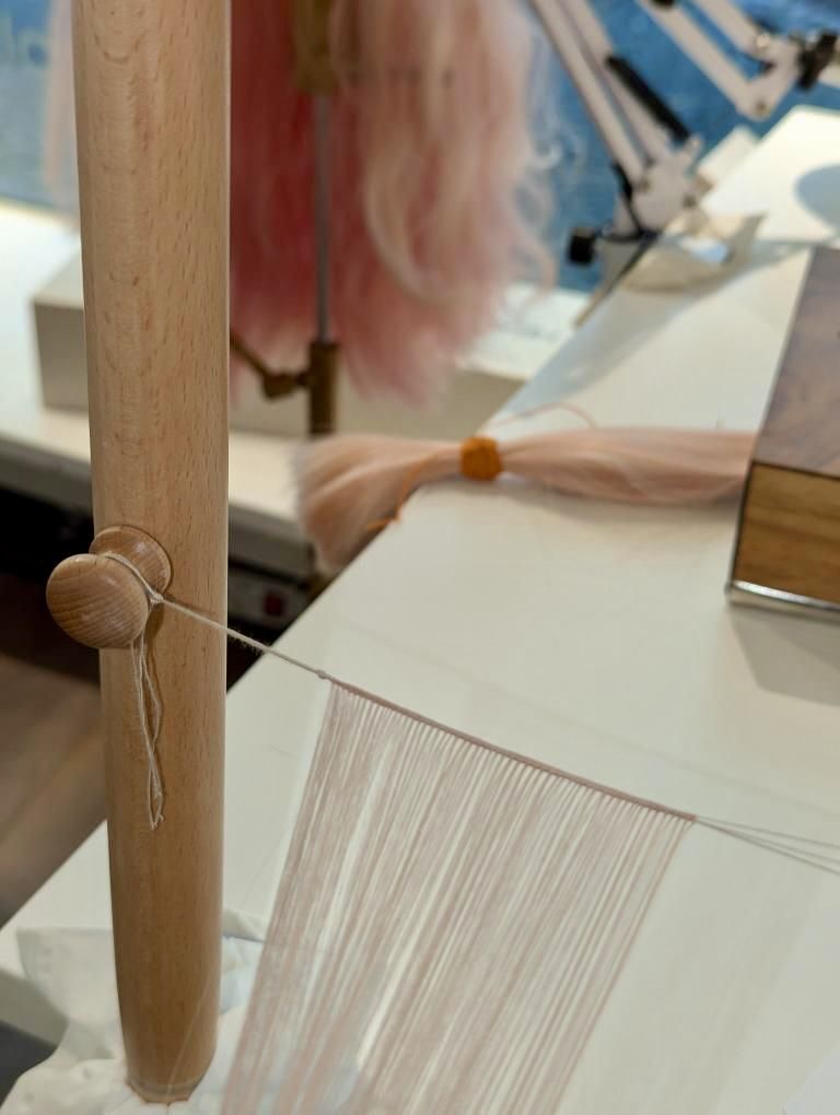 Hand-weaving wefts on the traditional warp